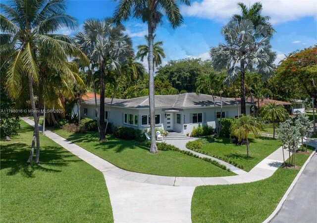 5550 N Bayshore Dr, Miami, FL 33137 - ranch-style home with a front yard and stucco siding