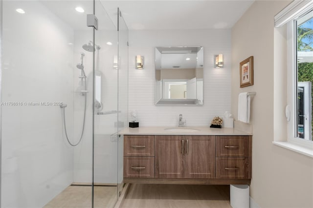 5550 N Bayshore Dr, Miami, FL 33137 - bathroom with vanity, a stall shower, and decorative backsplash
