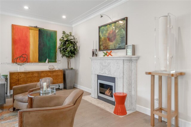 5550 N Bayshore Dr, Miami, FL 33137 - living area featuring ornamental molding, a fireplace, wood finished floors, and recessed lighting