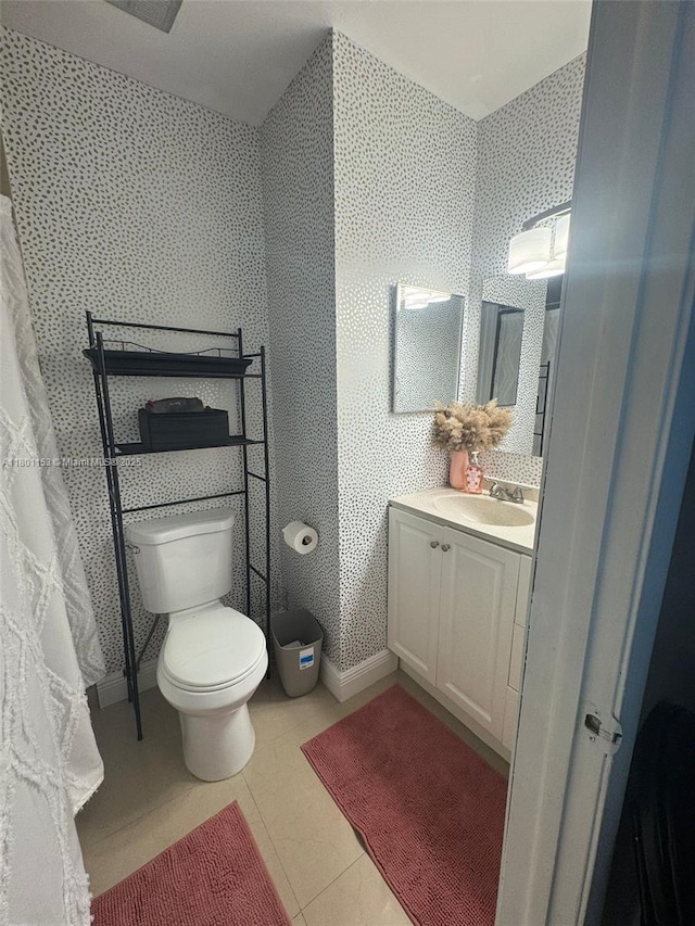 8389 NW 8th St, Miami, FL 33126 - bathroom featuring toilet, vanity, tile patterned flooring, and wallpapered walls