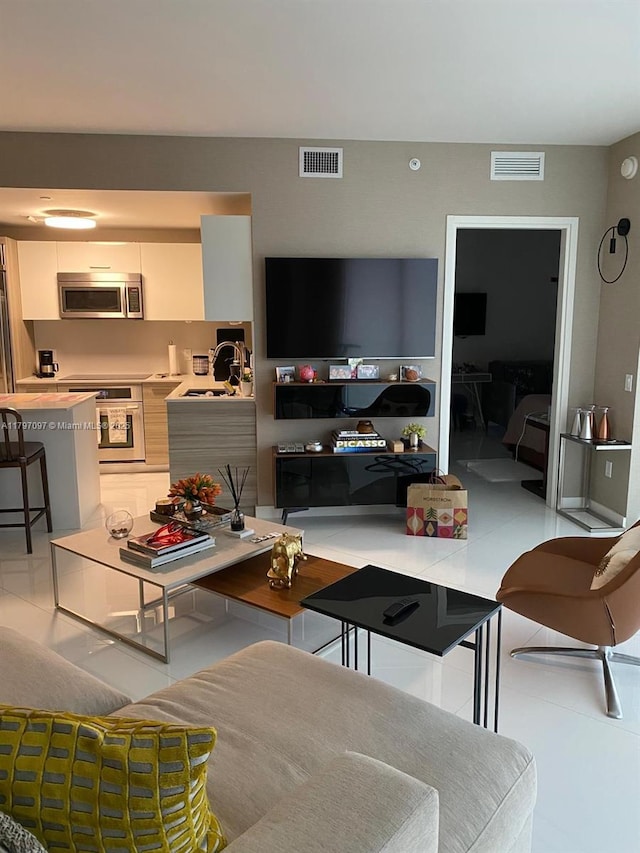 living room featuring light tile patterned floors