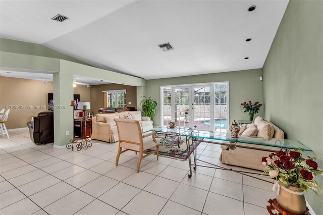 8620 SW 181st St, Palmetto Bay, FL 33157 - living area with french doors, plenty of natural light, light tile patterned flooring, and vaulted ceiling