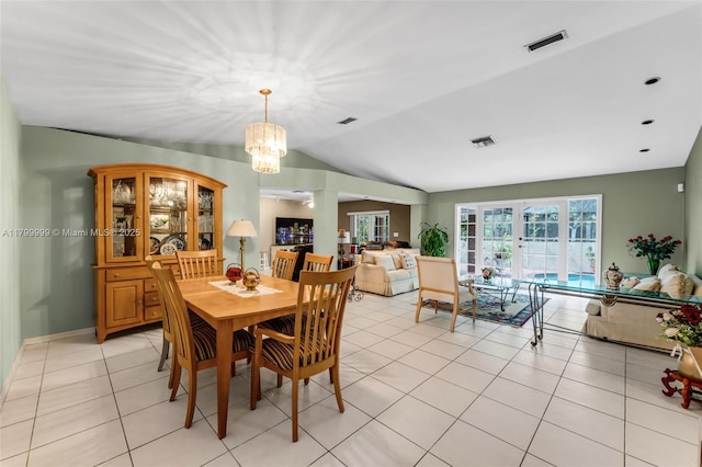 8620 SW 181st St, Palmetto Bay, FL 33157 - dining space with a chandelier, vaulted ceiling, french doors, and light tile patterned flooring
