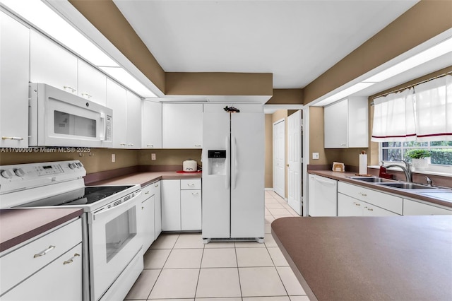 8620 SW 181st St, Palmetto Bay, FL 33157 - kitchen featuring white appliances, white cabinetry, and light tile patterned floors