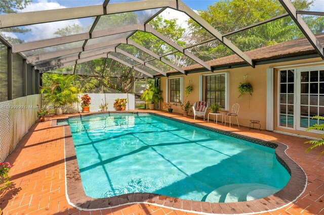 8620 SW 181st St, Palmetto Bay, FL 33157 - view of pool with a patio area and a lanai