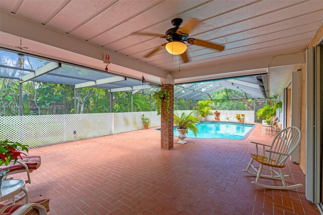 8620 SW 181st St, Palmetto Bay, FL 33157 - view of patio featuring a ceiling fan, a fenced backyard, and glass enclosure