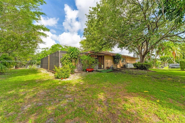8620 SW 181st St, Palmetto Bay, FL 33157 - view of green lawn featuring a lanai