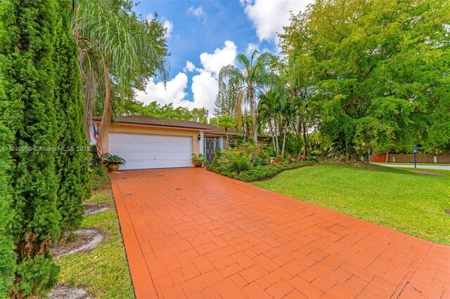 8620 SW 181st St, Palmetto Bay, FL 33157 - view of front of house with a garage and driveway