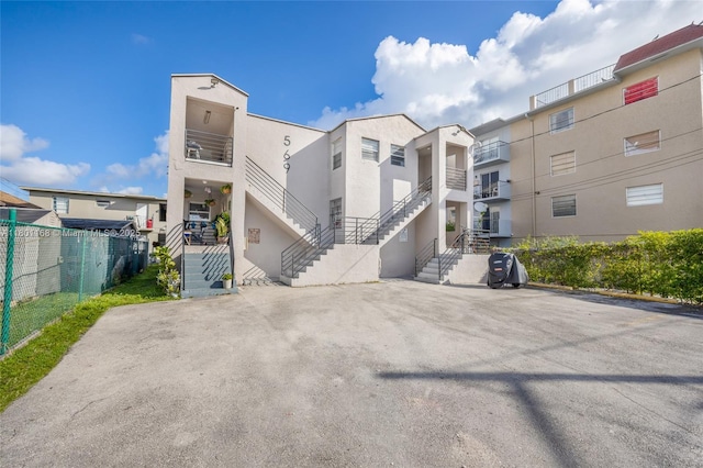 569 SW 4th St, Miami, FL 33130 - view of property with fence and stairway