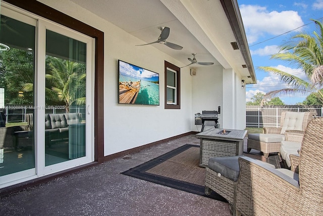 view of patio featuring fence, ceiling fan, a fire pit, and a grill