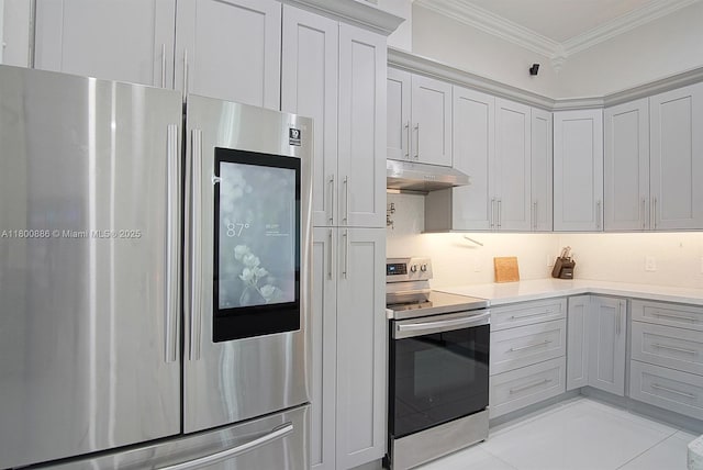 kitchen with appliances with stainless steel finishes, under cabinet range hood, light countertops, and ornamental molding