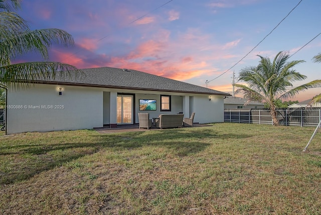back of property featuring stucco siding