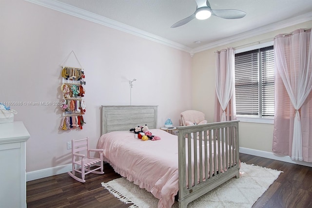 bedroom with ornamental molding, wood finished floors, baseboards, and ceiling fan