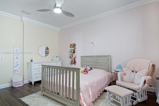 bedroom featuring crown molding, wood finished floors, baseboards, and a ceiling fan