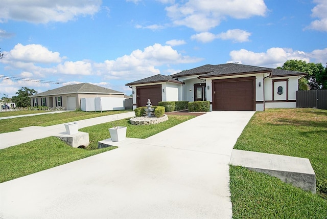 view of front facade featuring an attached garage, stucco siding, and concrete driveway