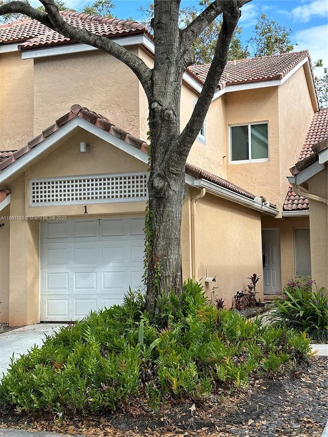 23158 Island Vw Unit 1, Boca Raton, FL 33433 - view of front of home featuring a tiled roof and stucco siding