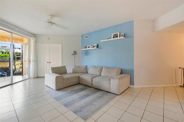 23158 Island Vw Unit 1, Boca Raton, FL 33433 - living room featuring light tile patterned floors and baseboards