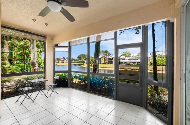 23158 Island Vw Unit 1, Boca Raton, FL 33433 - sunroom featuring a water view and a ceiling fan