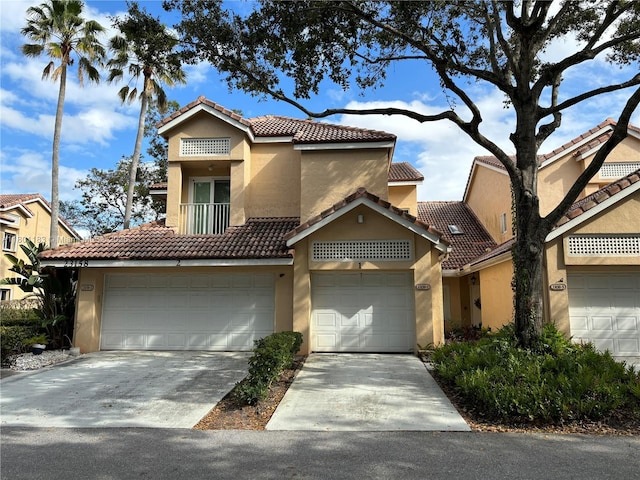 23158 Island Vw Unit 1, Boca Raton, FL 33433 - view of front of home featuring stucco siding, a tile roof, and driveway