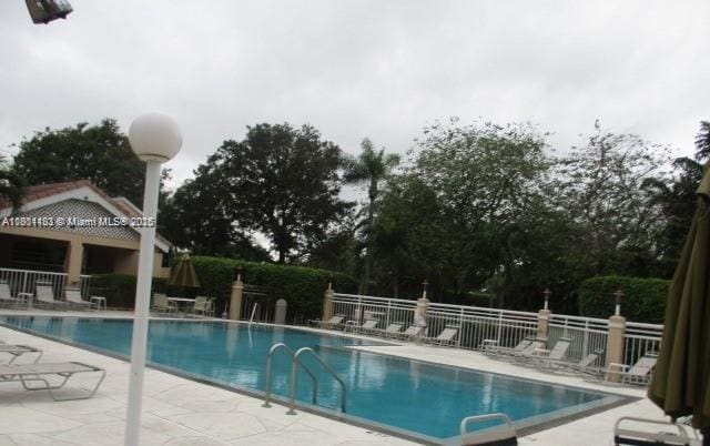 23158 Island Vw Unit 1, Boca Raton, FL 33433 - community pool with a patio area and fence