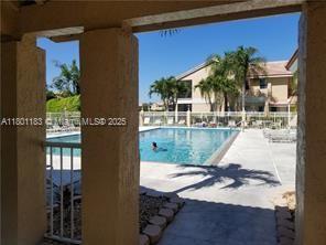 23158 Island Vw Unit 1, Boca Raton, FL 33433 - community pool with a patio area