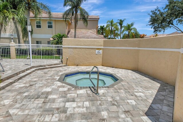 23158 Island Vw Unit 1, Boca Raton, FL 33433 - workout room with vaulted ceiling, ceiling fan, plenty of natural light, a skylight, and carpet