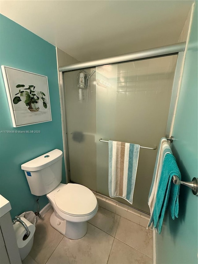 400 SE 10th St Unit 214, Deerfield Beach, FL 33441 - full bath featuring a stall shower, toilet, and tile patterned floors