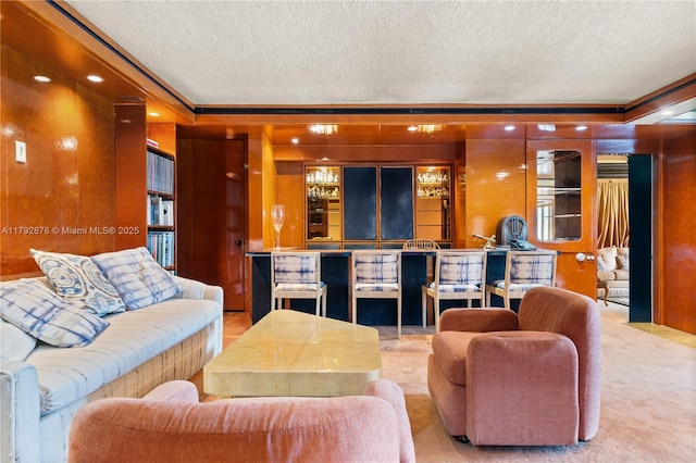 11111 Biscayne Blvd Unit 227, Miami, FL 33181 - living room featuring a textured ceiling, ornamental molding, carpet flooring, and wooden walls