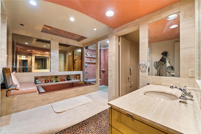 11111 Biscayne Blvd Unit 227, Miami, FL 33181 - bathroom with recessed lighting, tile walls, vanity, and a garden tub