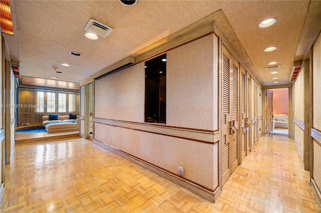 11111 Biscayne Blvd Unit 227, Miami, FL 33181 - corridor featuring a textured ceiling, baseboards, and recessed lighting