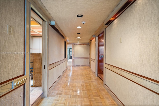 11111 Biscayne Blvd Unit 227, Miami, FL 33181 - hallway with a textured wall and a textured ceiling
