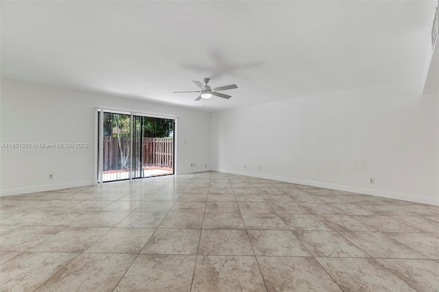 unfurnished room with ceiling fan, baseboards, and light tile patterned floors