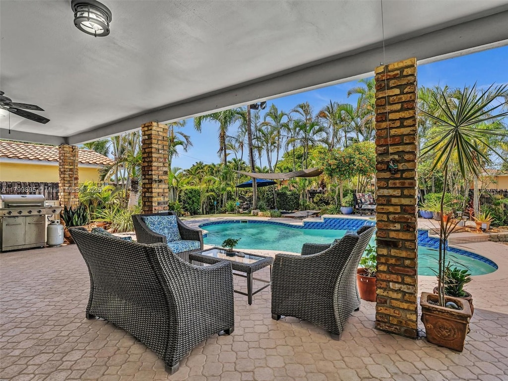 5119 Hayes St, Hollywood, FL 33021 - view of patio with an outdoor pool, grilling area, and ceiling fan