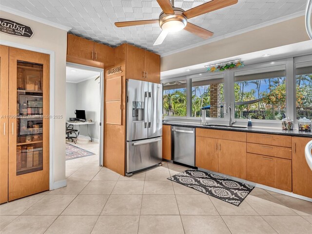 5119 Hayes St, Hollywood, FL 33021 - kitchen with appliances with stainless steel finishes, a sink, crown molding, an office area, and dark countertops