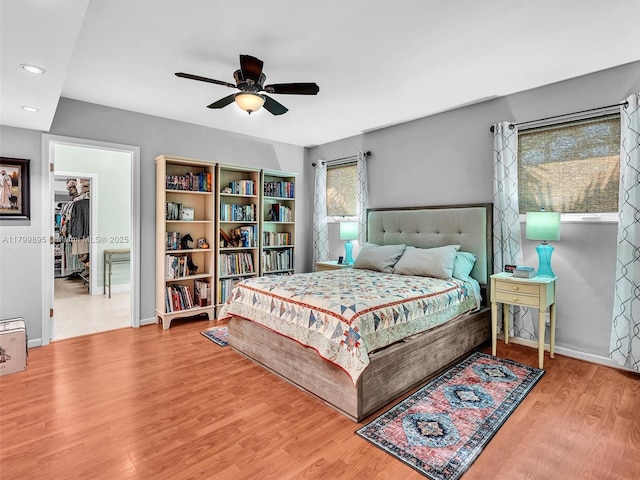 5119 Hayes St, Hollywood, FL 33021 - bedroom featuring wood finished floors, recessed lighting, baseboards, ceiling fan, and a walk in closet