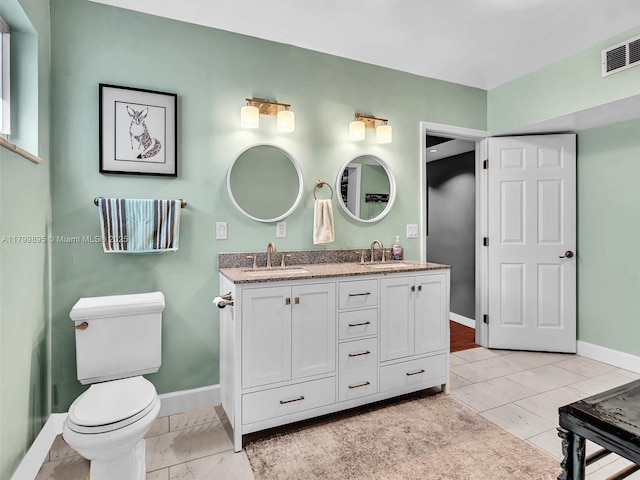 5119 Hayes St, Hollywood, FL 33021 - bathroom featuring baseboards, double vanity, and toilet