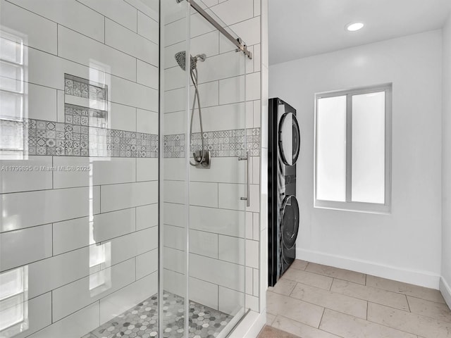 5119 Hayes St, Hollywood, FL 33021 - bathroom featuring stacked washer and clothes dryer, baseboards, a stall shower, and recessed lighting