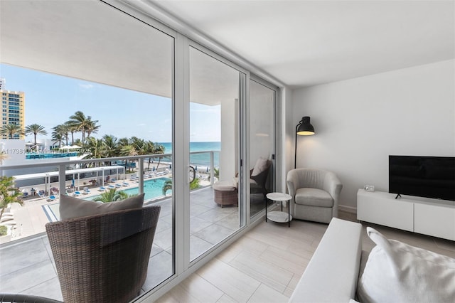 2751 S Ocean Dr Unit 403S, Hollywood, FL 33019 - living room featuring a wall of windows and baseboards