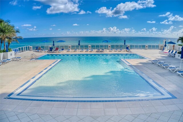 2751 S Ocean Dr Unit 403S, Hollywood, FL 33019 - community pool featuring a patio, fence, and a water view