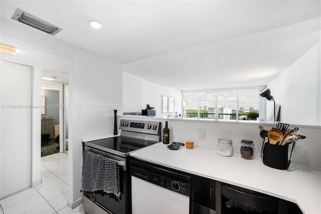 100 NW Bayview Dr Unit 1502, Sunny Isles Beach, FL 33160 - kitchen with dishwasher, electric range, light tile patterned floors, light countertops, and recessed lighting