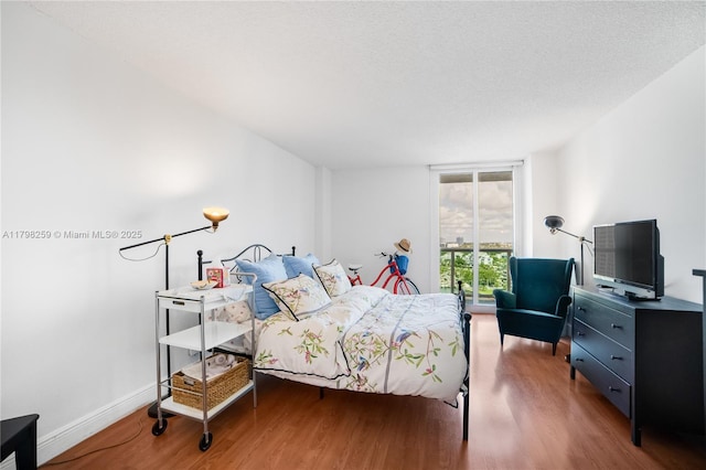 100 NW Bayview Dr Unit 1502, Sunny Isles Beach, FL 33160 - bedroom with wood finished floors and baseboards