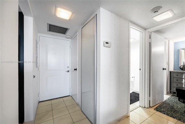 100 NW Bayview Dr Unit 1502, Sunny Isles Beach, FL 33160 - hallway with light tile patterned flooring