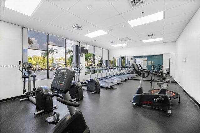 100 NW Bayview Dr Unit 1502, Sunny Isles Beach, FL 33160 - exercise room featuring a drop ceiling and a wall of windows