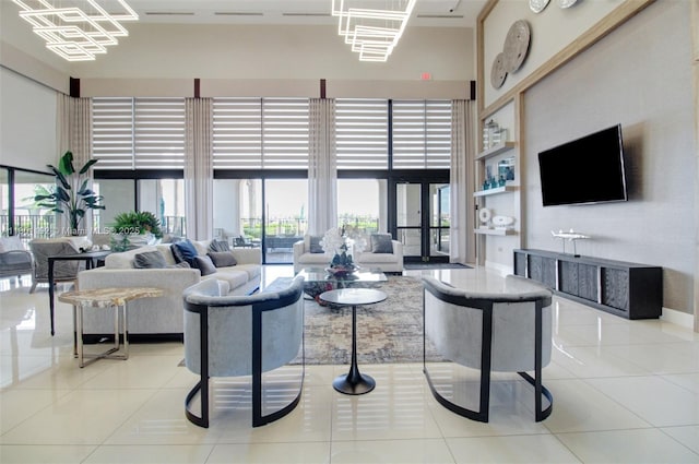 lobby featuring a towering ceiling and expansive windows