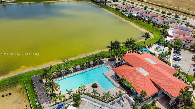 bird's eye view of a pool and a nearby body of water