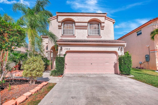 1562 NW 157th Ave, Pembroke Pines, FL 33028 - mediterranean / spanish-style house with driveway, an attached garage, stucco siding, and a tiled roof