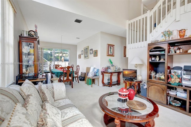 1562 NW 157th Ave, Pembroke Pines, FL 33028 - carpeted living room with a chandelier