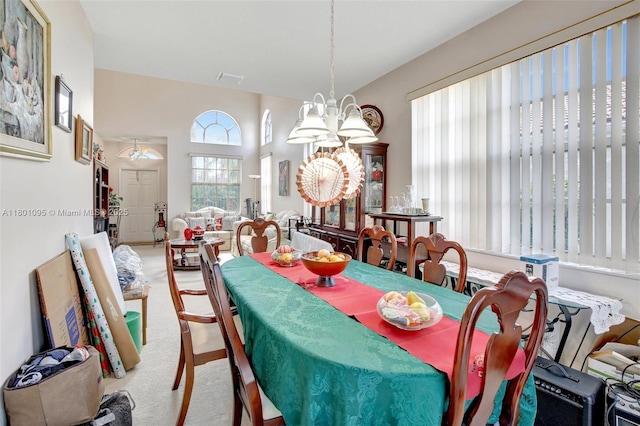 1562 NW 157th Ave, Pembroke Pines, FL 33028 - carpeted dining area featuring a chandelier