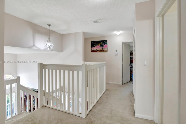 1562 NW 157th Ave, Pembroke Pines, FL 33028 - hallway with carpet flooring, a textured ceiling, baseboards, and an upstairs landing