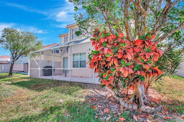 1562 NW 157th Ave, Pembroke Pines, FL 33028 - view of side of property featuring a patio, stucco siding, and a lanai